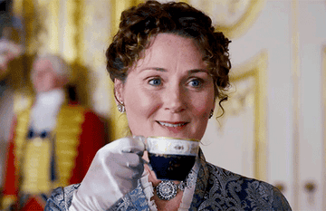Lady Featherington from Bridgerton sipping tea 