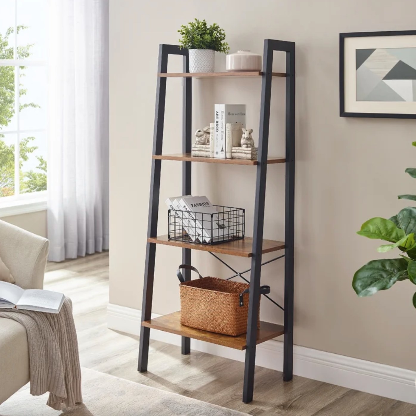 The steel bookcase with wood shelves holding a basket of books and a plant