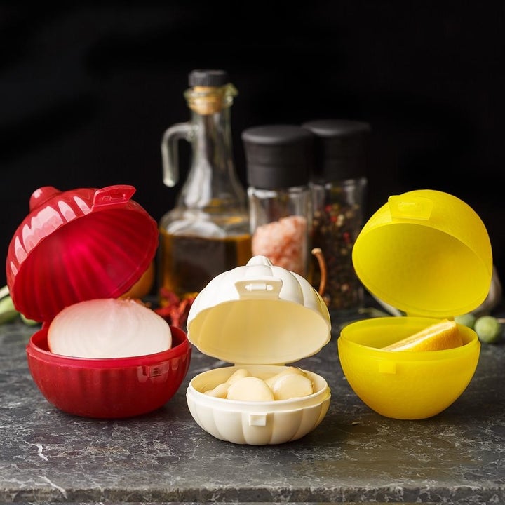 The three open containers with their respective vegetables inside