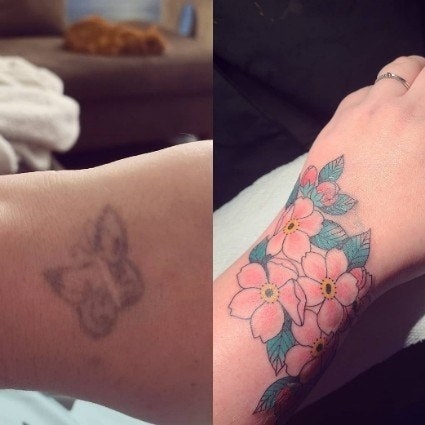 A faded butterfly tattoo and a wrap around cover-up of flowers