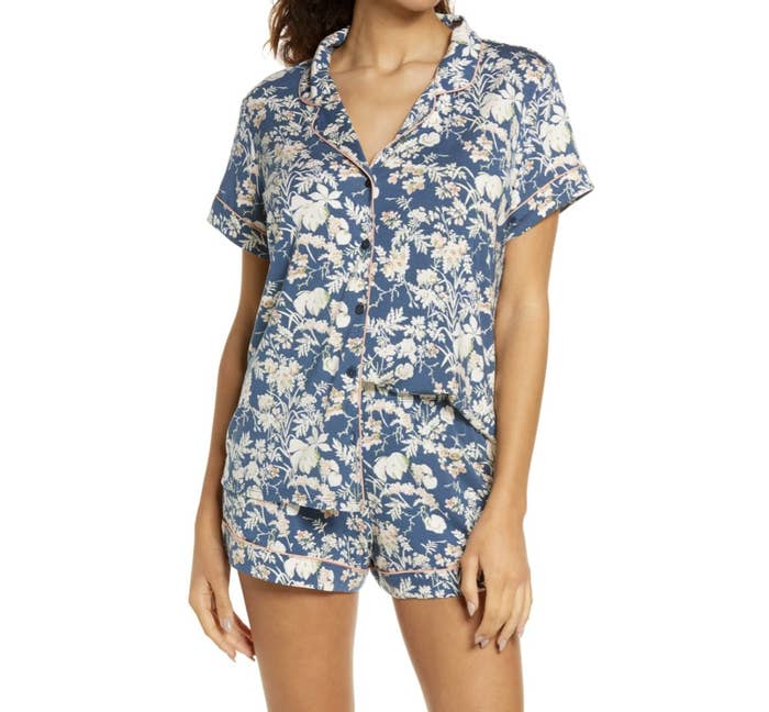 Model is wearing a blue and white floral pajama set