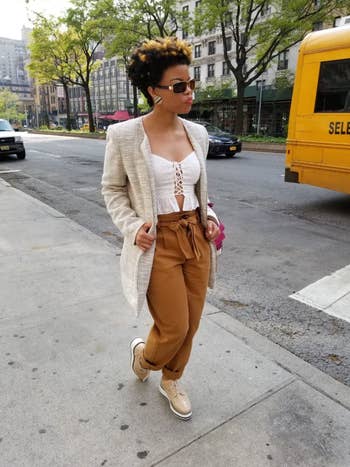 reviewer wears apricot platform oxfords with mustard tie-waist pants, a cami, and a white blazer jacket