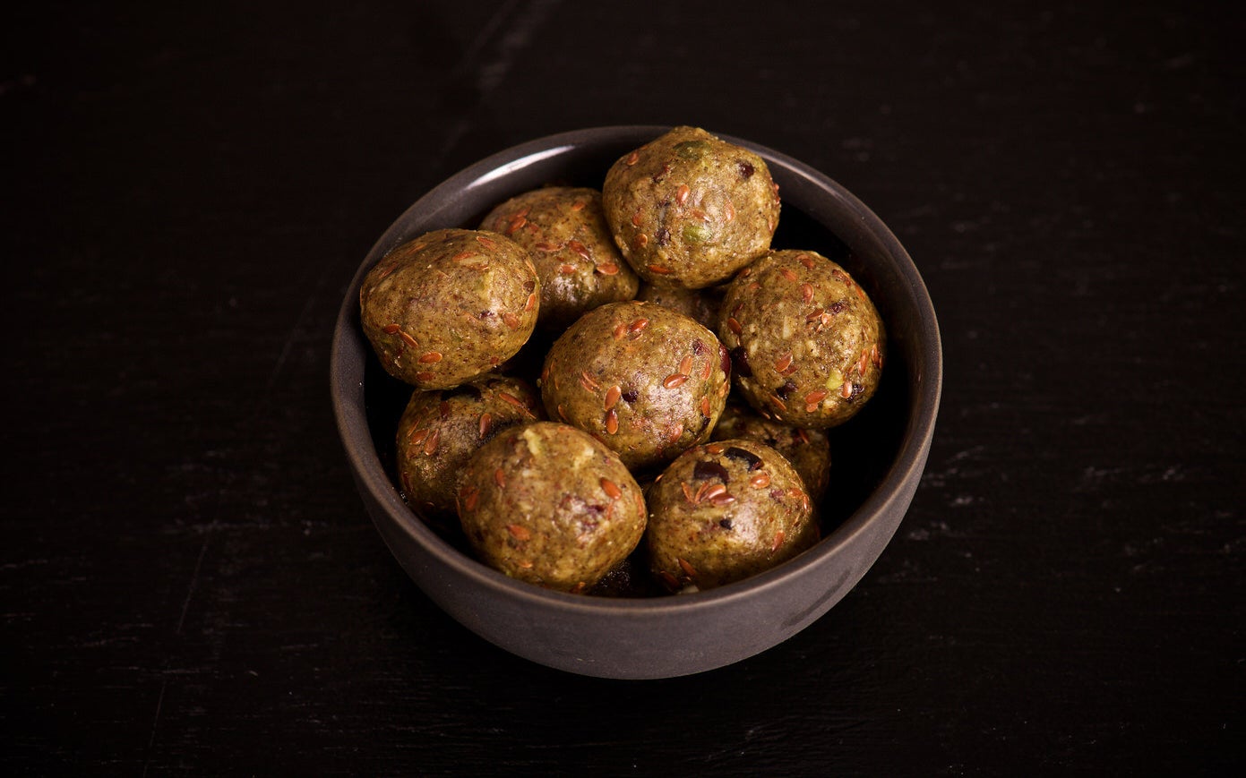 a bow filled with round almond butter bites 