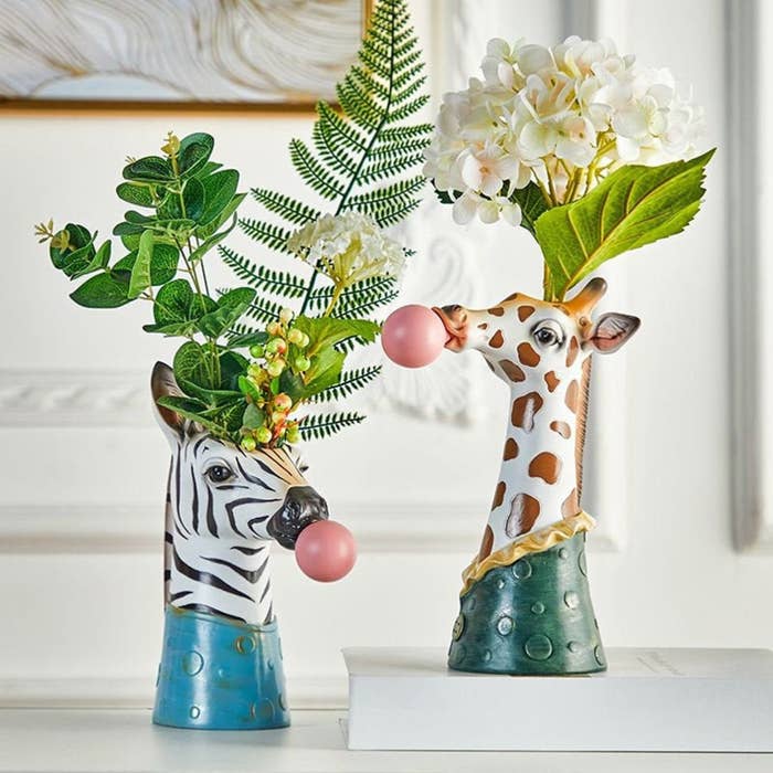 zebra and giraffe vases blowing bubbles
