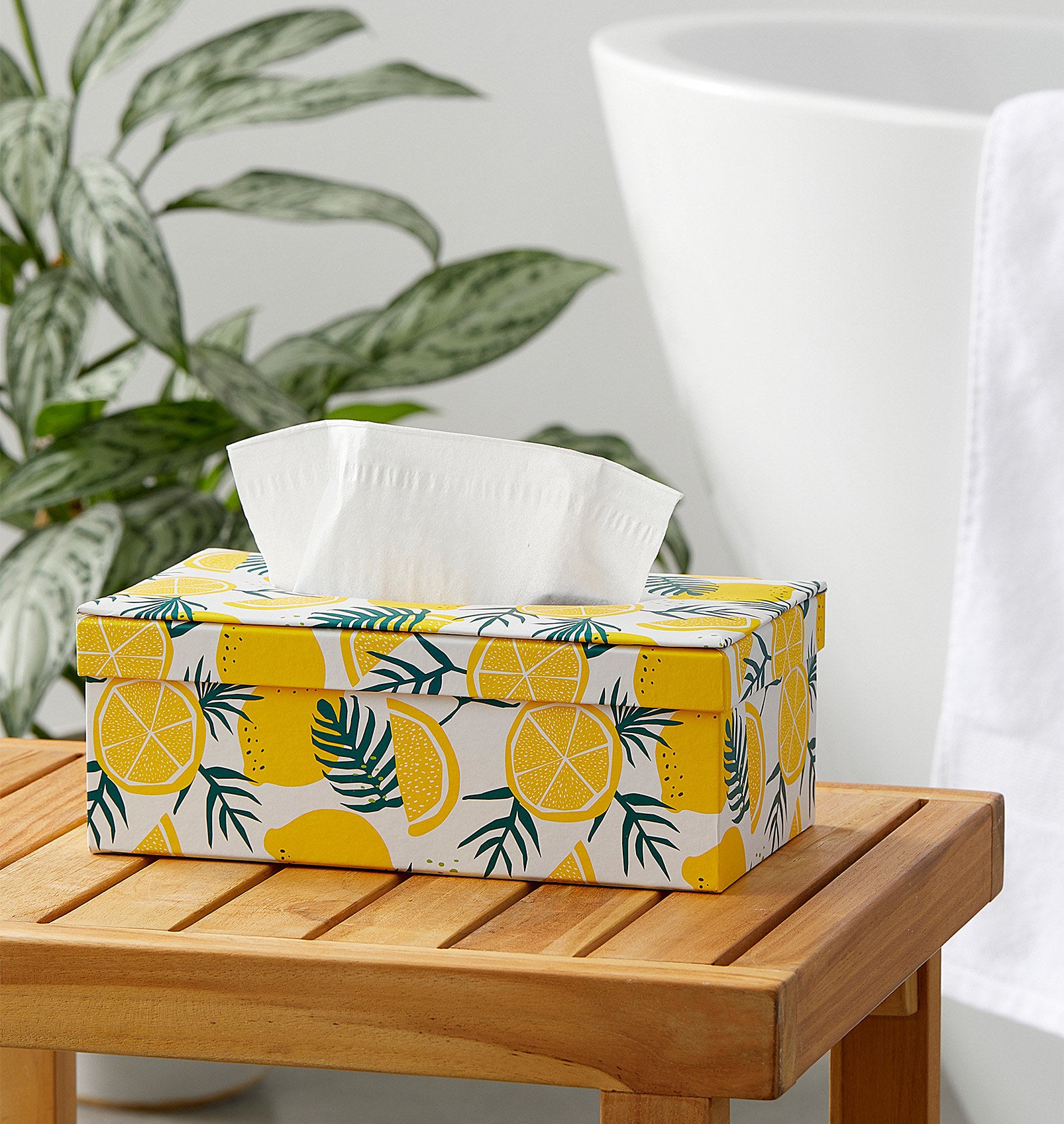 A lemon-print tissue box holder 