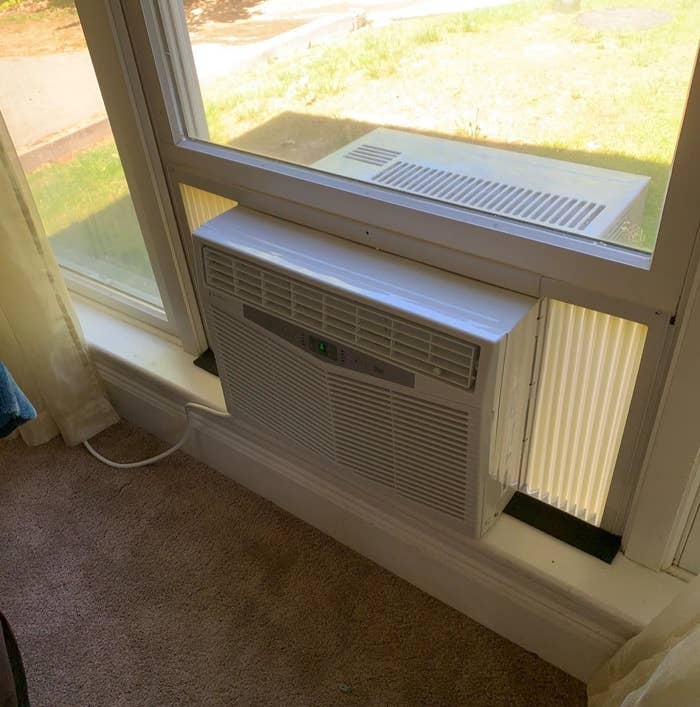 the TaoTronics 3-in-1 air conditioner in a window