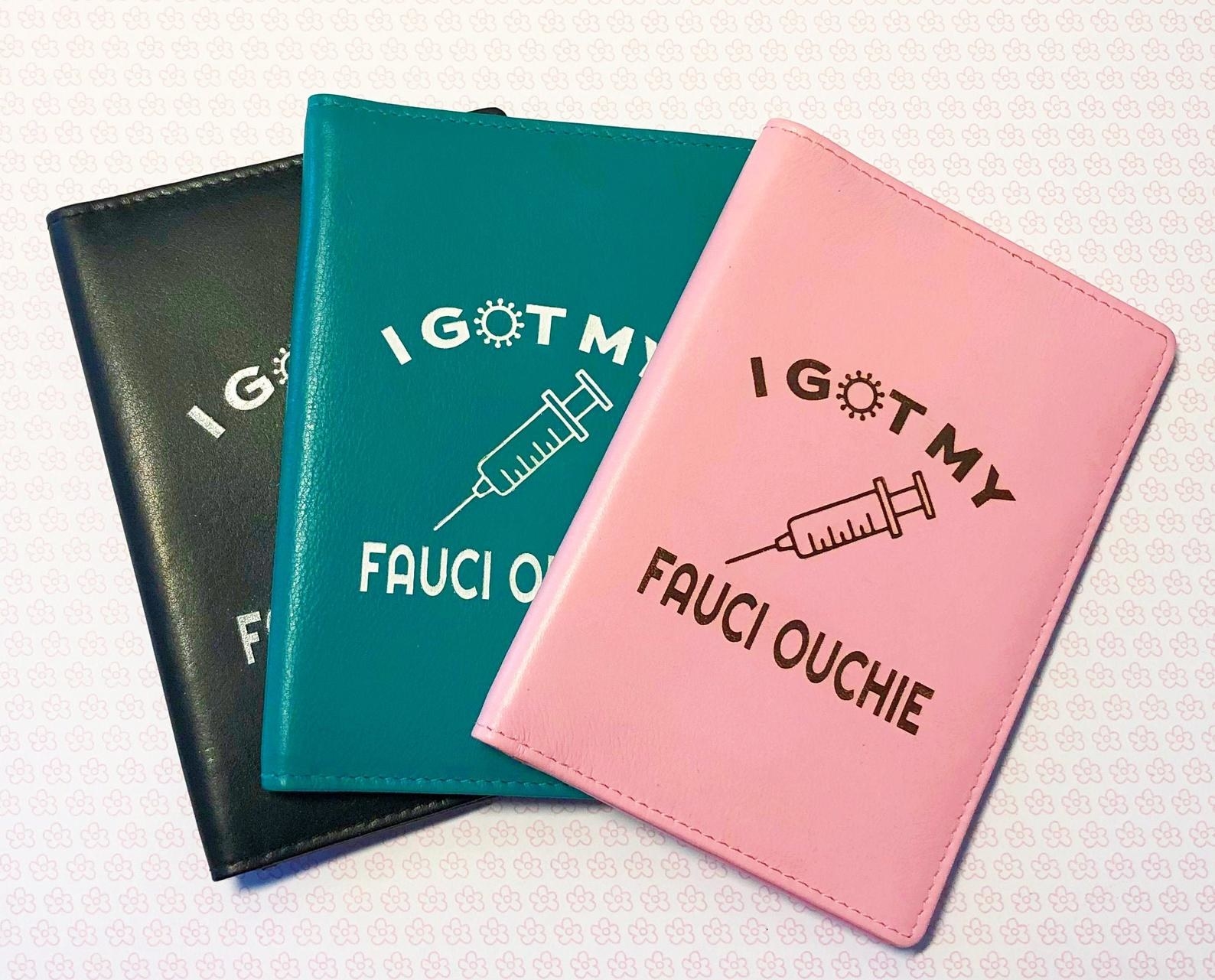 the black, turquoise, and pink card holders