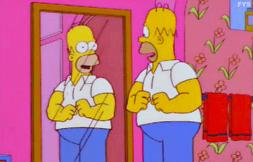 GIF of Homer flexing and his shirt ripping