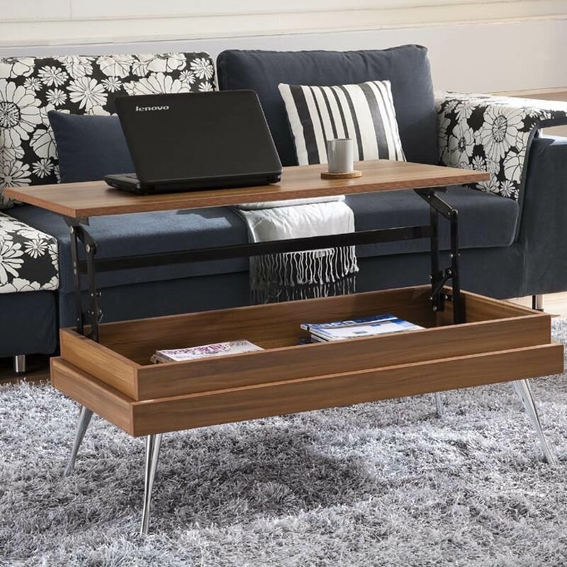 walnut coffee table with lift top raised and laptop and mug on top, and storage underneath
