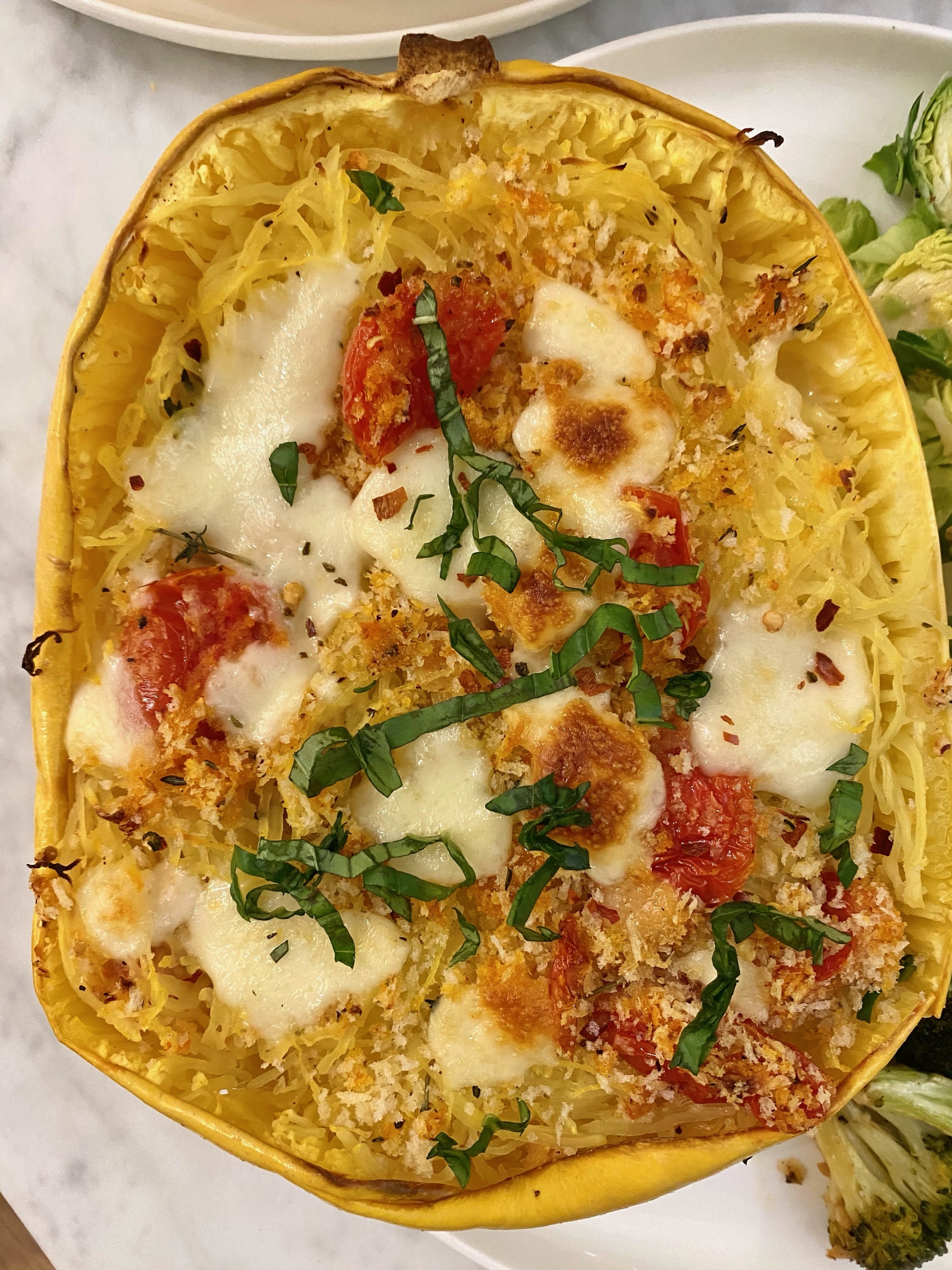 A Caprese stuffed spaghetti squash. 