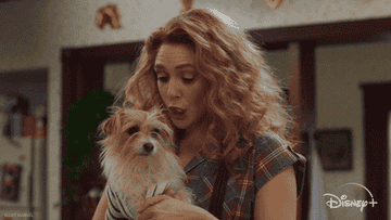 elizabeth olsen cuddling a dog in &quot;wandavision&quot;
