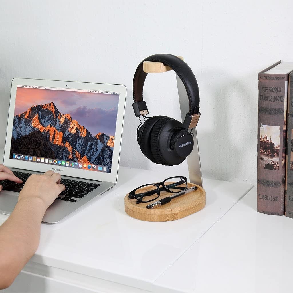 wooden and metal headphone stand with a tray at the bottom