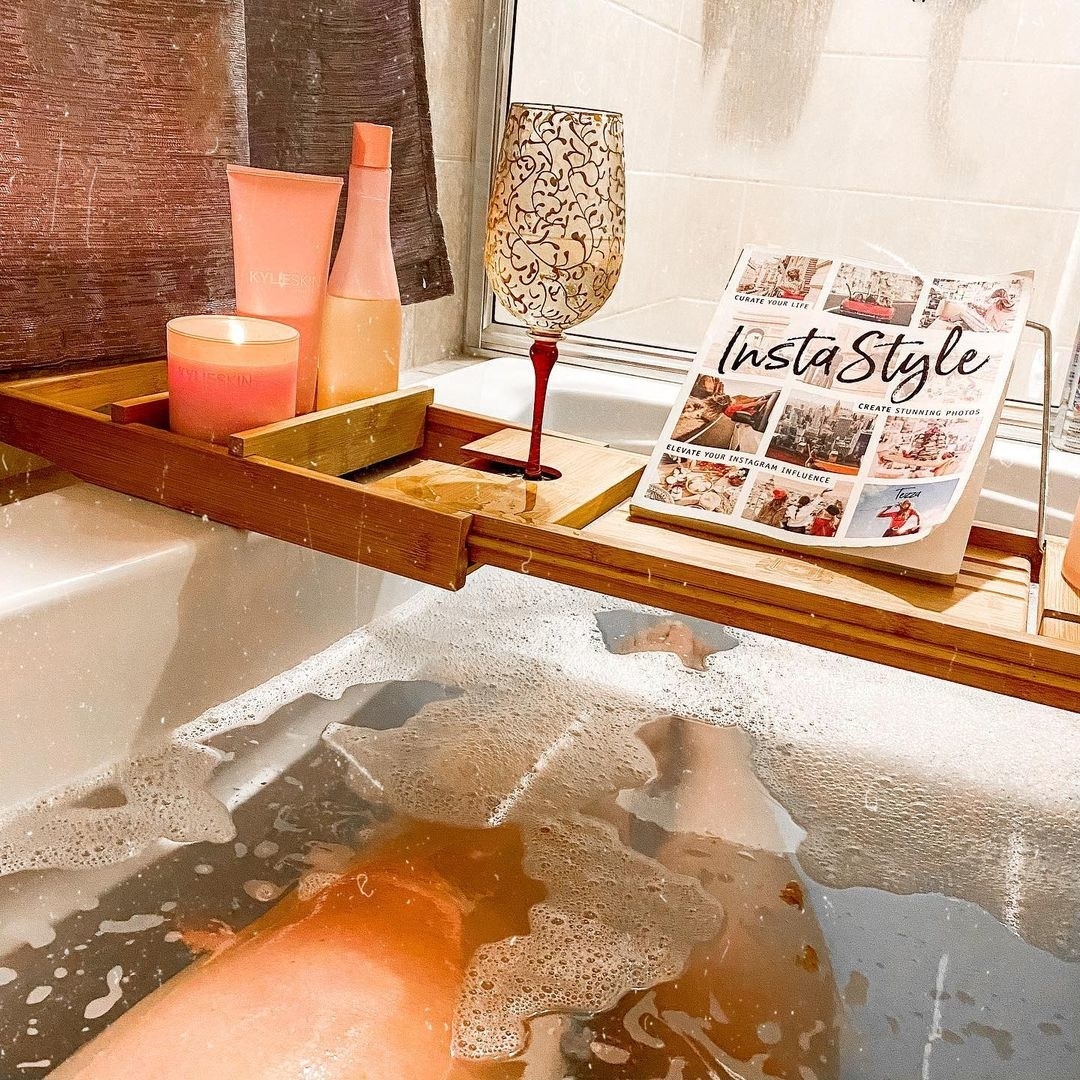 buzzfeed editor using the bamboo tray while taking a bath