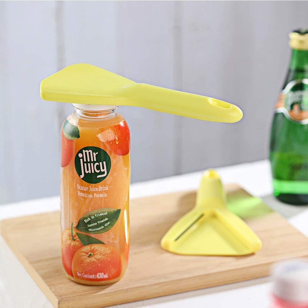 hand-help opener sitting on top of a drink 