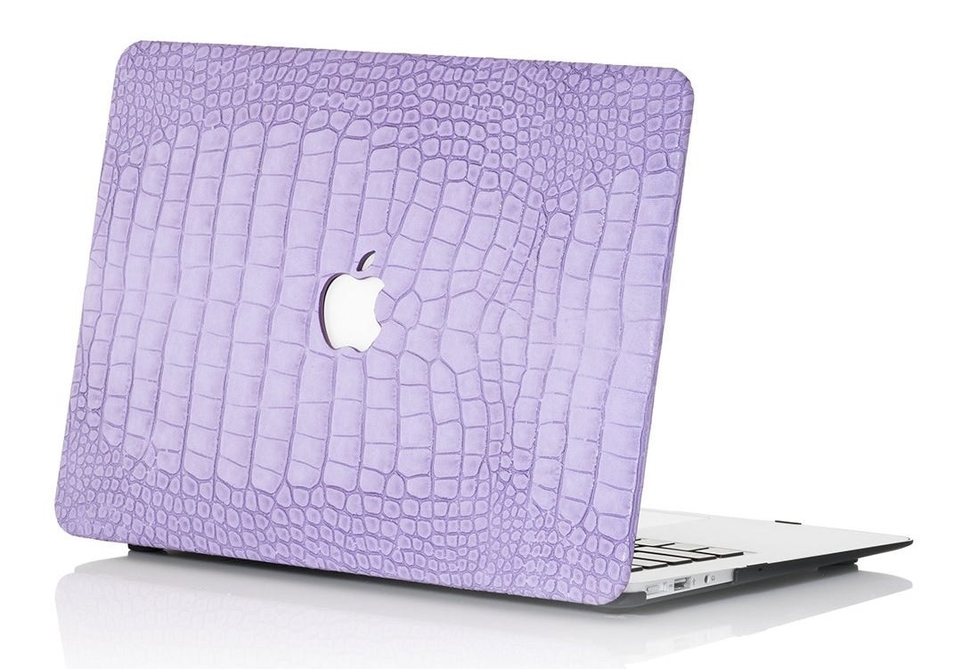 Apple laptop with a lavender cover in a faux-crocodile finish