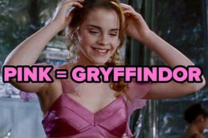 hermione granger smiles and holds her hands on her head. the words "pink = gryffindor" over the image