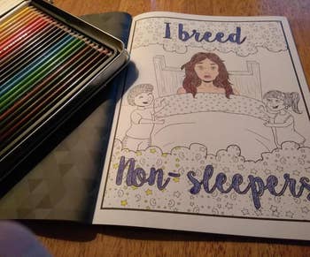 a reviewer's partially colored in coloring page of a mom in bed with two kids on the side and the text 