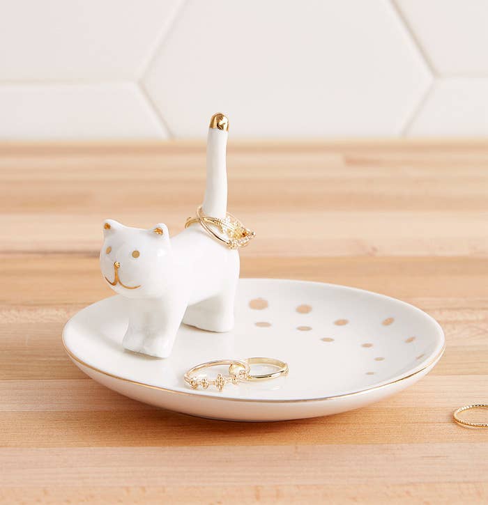 A jewelry tray with a cute cat to stack your rings on 