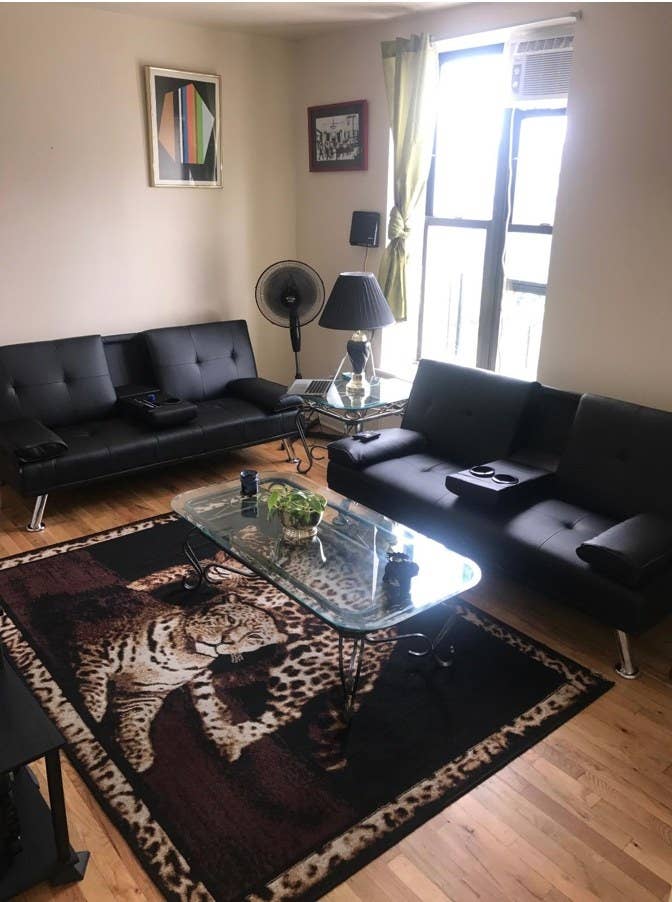 A faux leather futon in a reviewer&#x27;s home