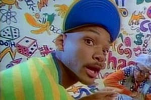 will smith as fresh prince with his mouth open, wearing a backward hat