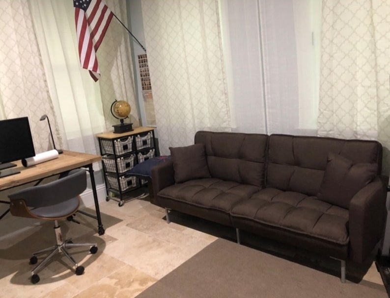 A brown futon in a reviewer&#x27;s home