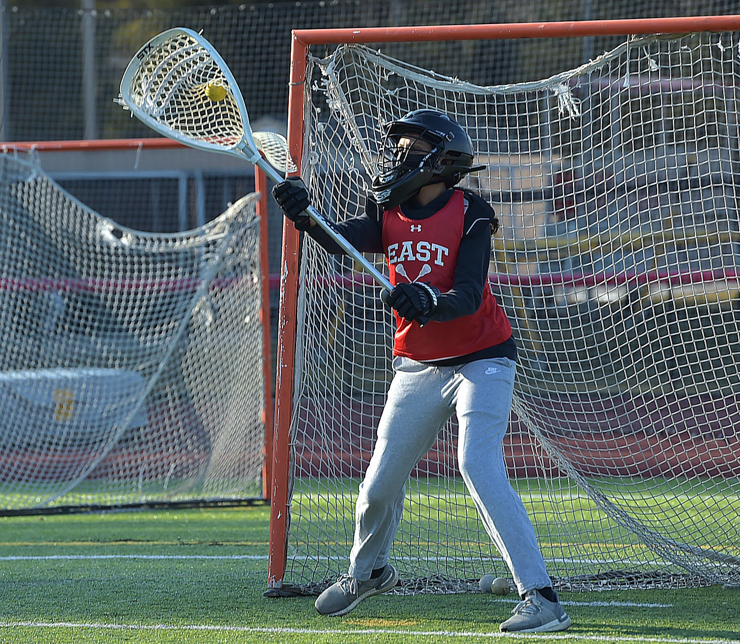 a person playing lacrosse