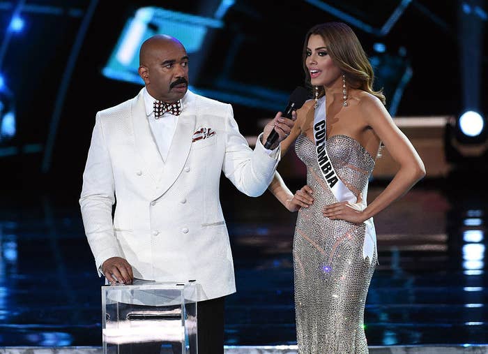 Steve Harvey (L) listens as Miss Colombia 2015, Ariadna Gutierrez Arevalo, answers a question during the interview portion of the 2015 Miss Universe Pageant