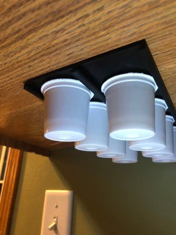 K-cup organizer installed underneath cabinet