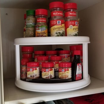 Reviewer photo of turntable with spices placed in cabinet