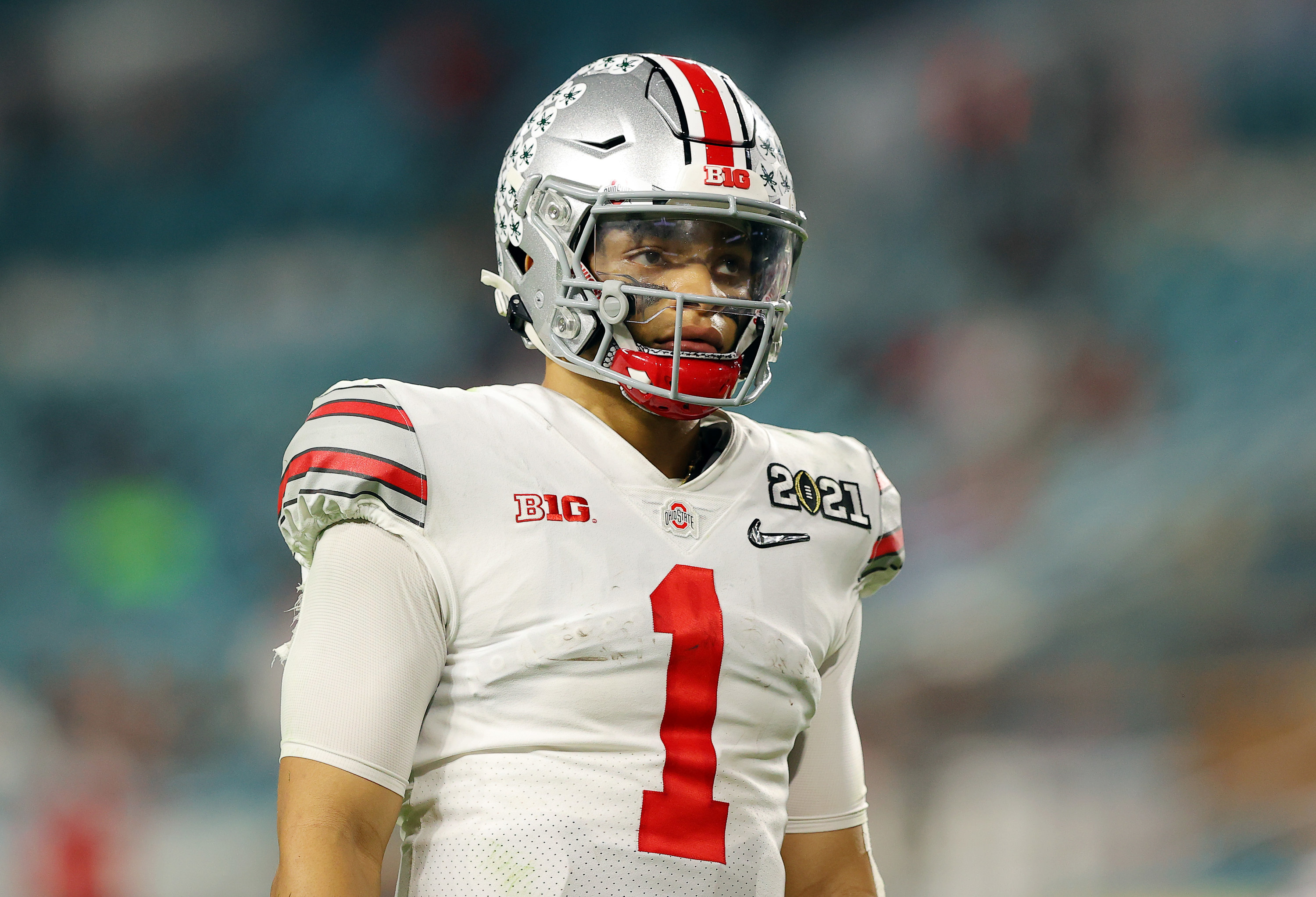 Justin Fields in white Ohio State uniform