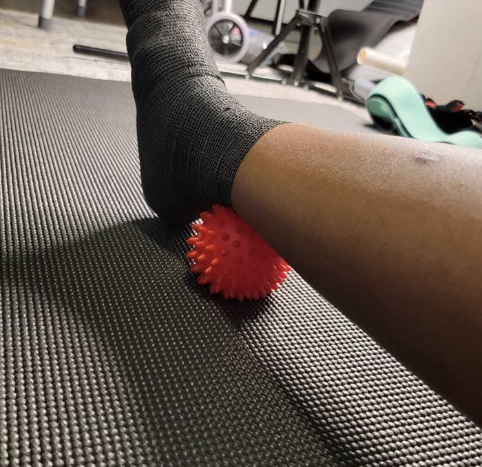 A person using the ball on their leg
