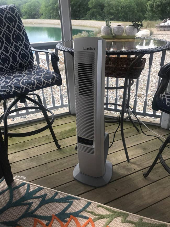 reviewer's fan placed in front of gazebo furniture