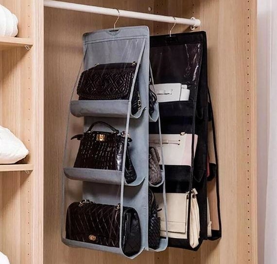 two different-colored, double-sided handbag organizers hanging in a closet 