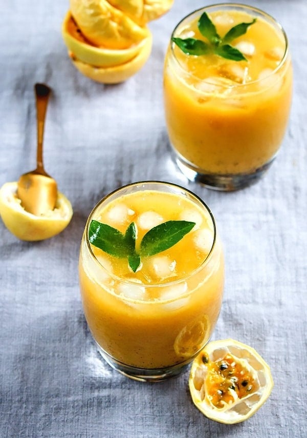 Two glasses of fresh passion fruit juice.