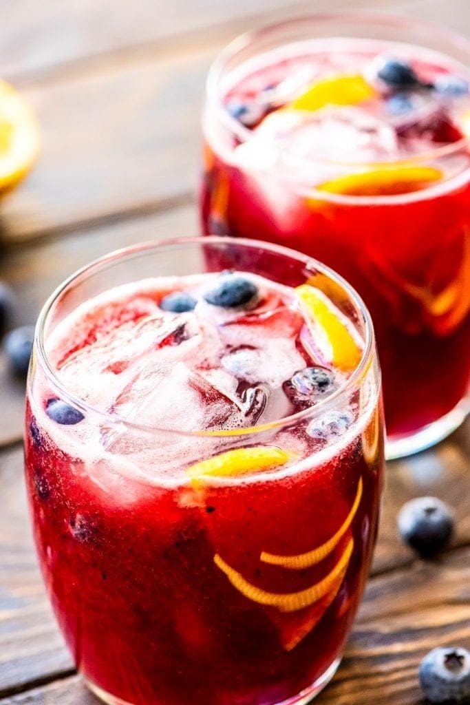 Two glasses of blueberry lemonade.