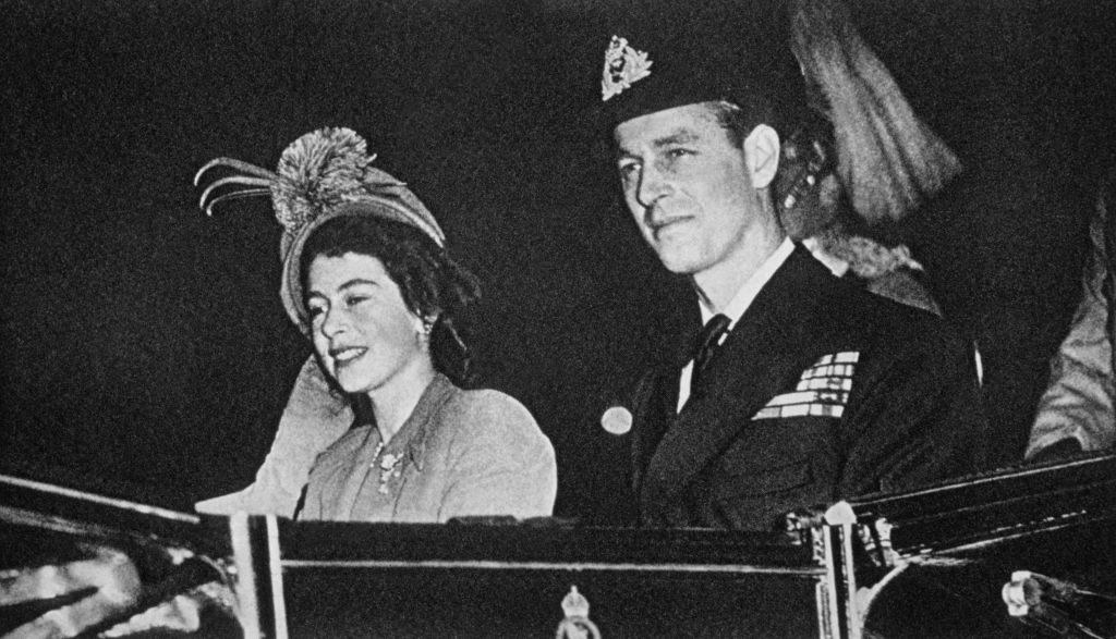 Prince Philip riding in a carriage with Elizabeth