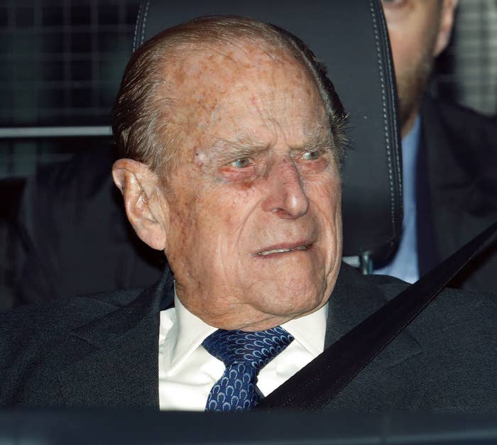 Prince Philip riding in a car