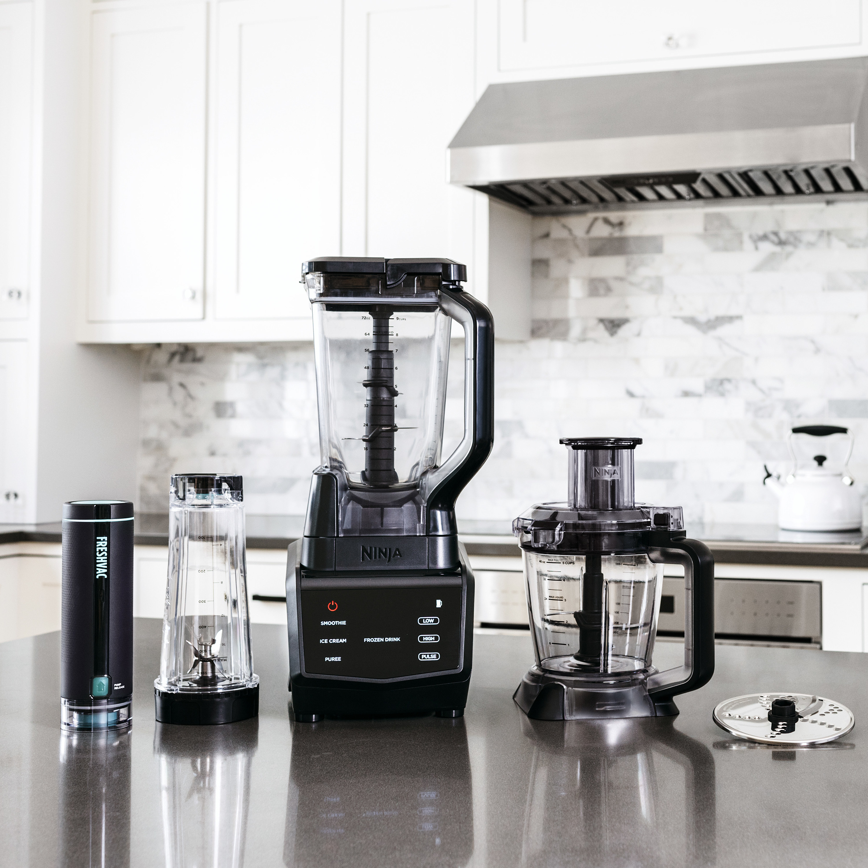 the blender and attachments on a counter