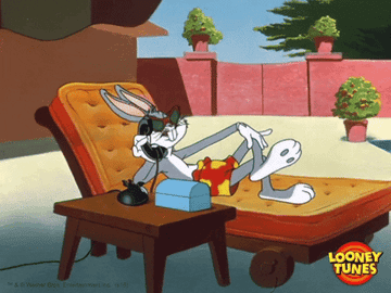 GIF of Bugs Bunny lounging on a chair and talking on the phone outside