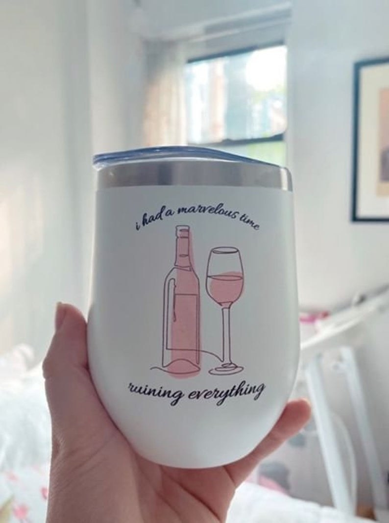 a white stemless wine tumbler that says  i had a marvelous time ruining everything