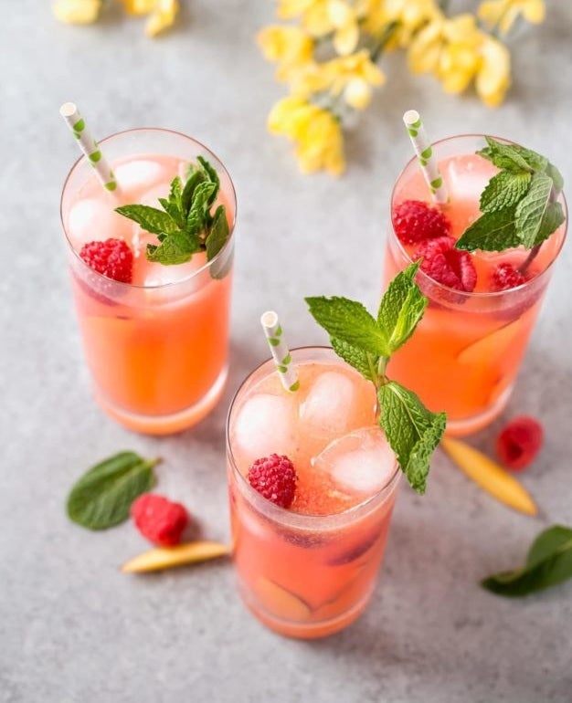 Three raspberry peach lemonades with mint.