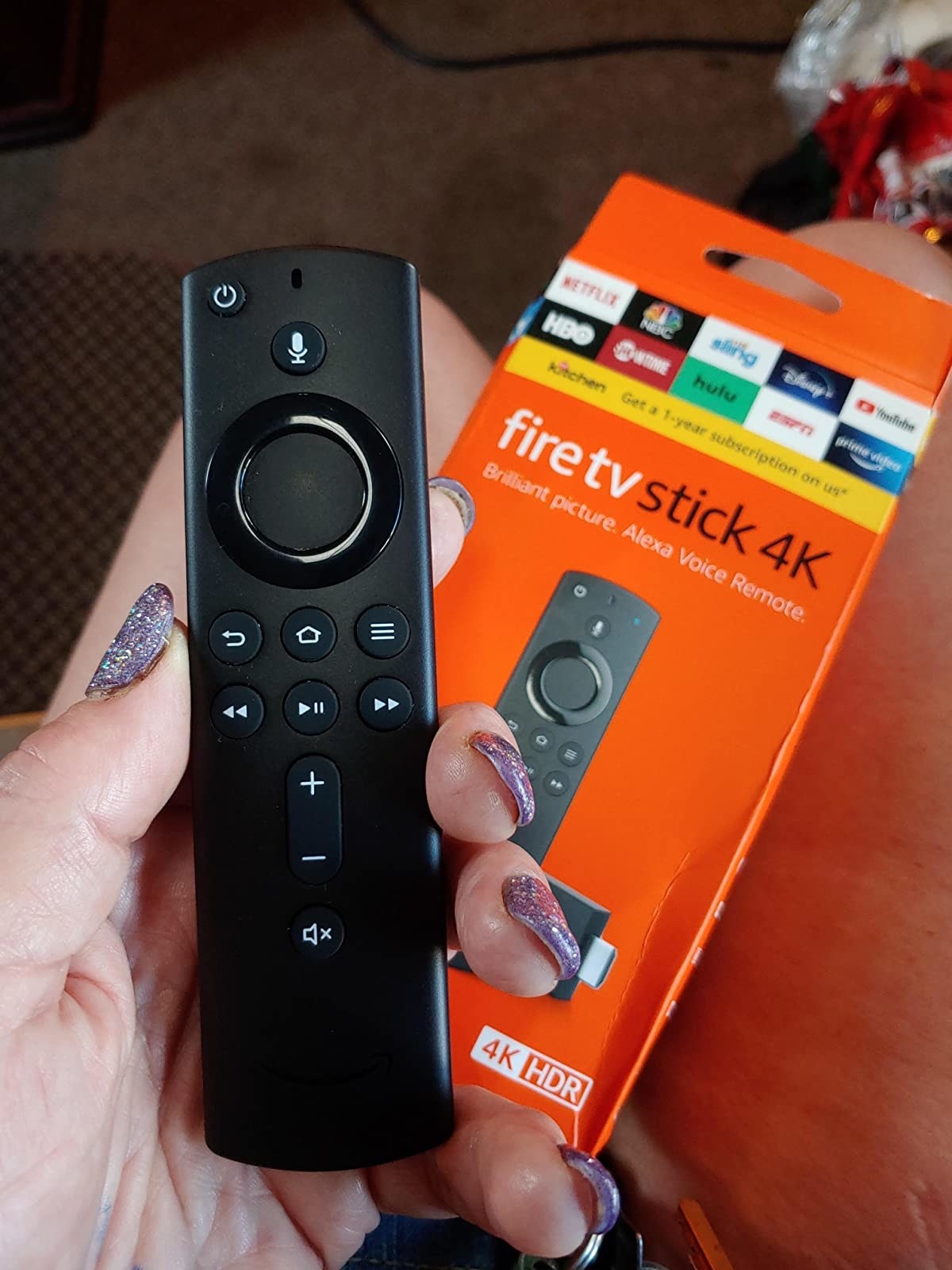 The Fire Stick remote, which has volume, power, and voice control buttons