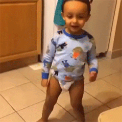 A toddler dancing in his diaper