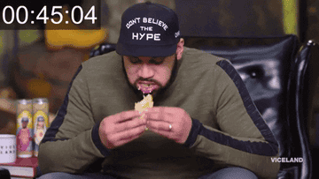 Guy eating big taco