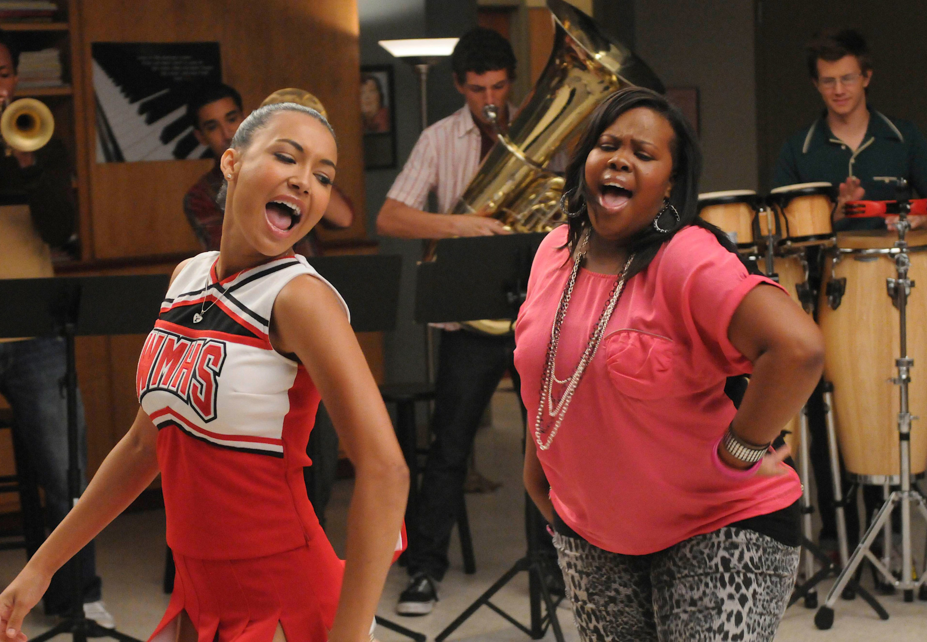 Rivera and Amber Riley sing in Glee