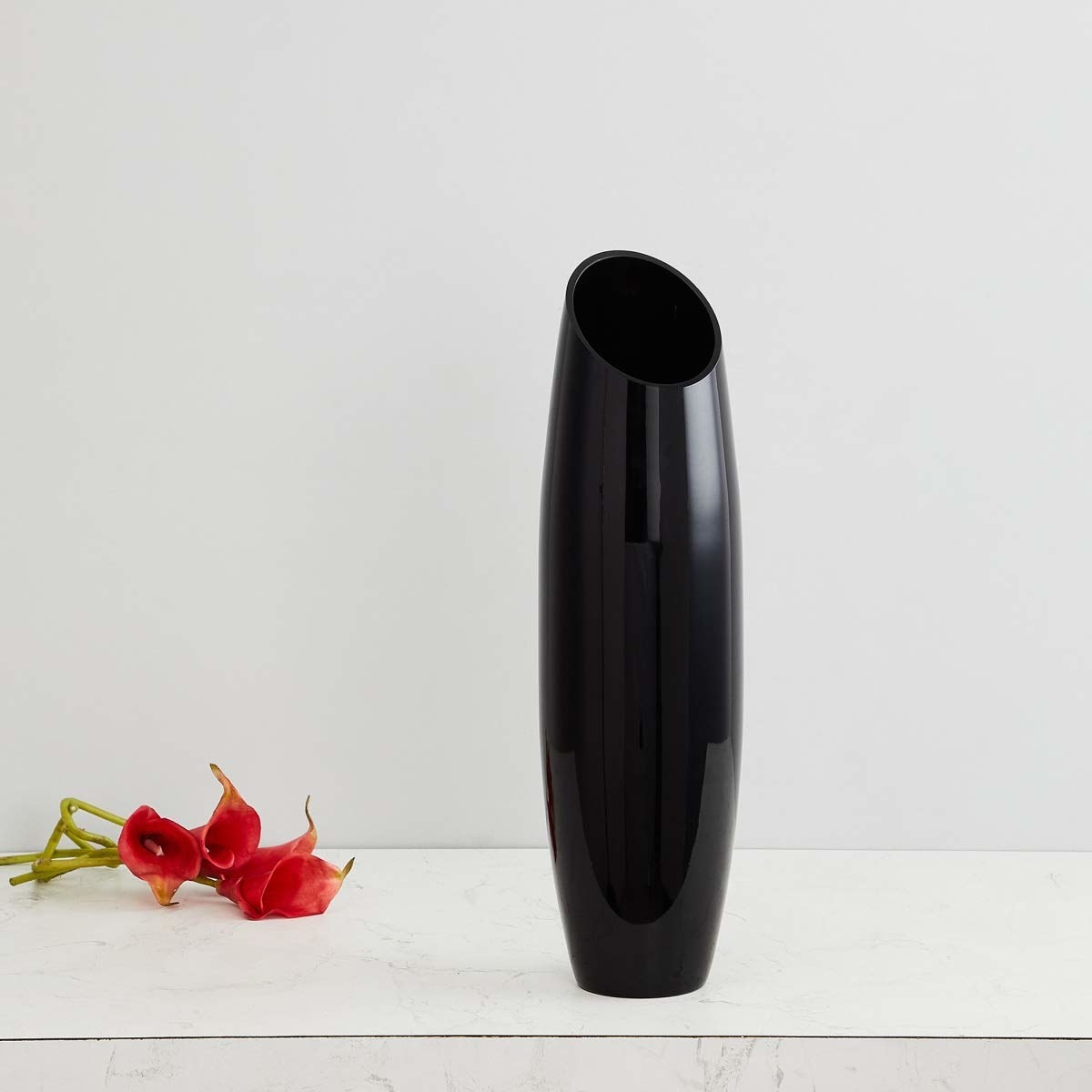 A black vase on the table 