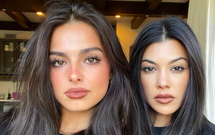 Addison and Kourtney wear full faces of makeup and sit side by side for a selfie