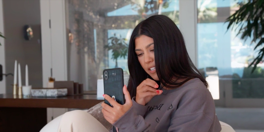 Kourtney talks on the phone