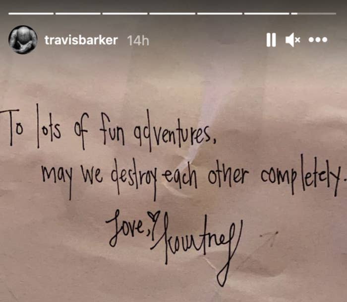 An Instagram story screenshot from Travis Barker shows a handwritten note that reads "To lots of fun adventures, may we destroy each other completely. Love, Kourtney"