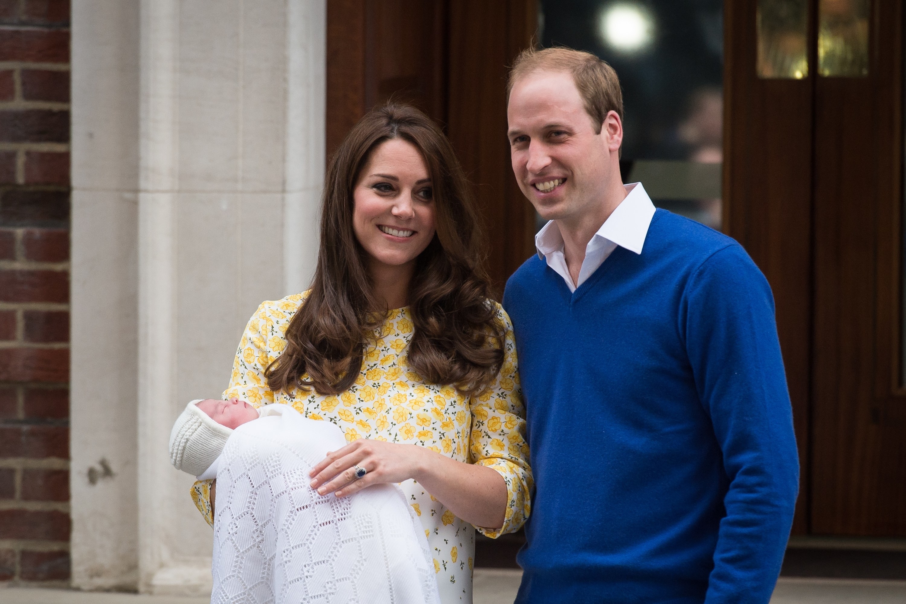 The Duke and Duchess of Cambridge holding Charlotte as an infant